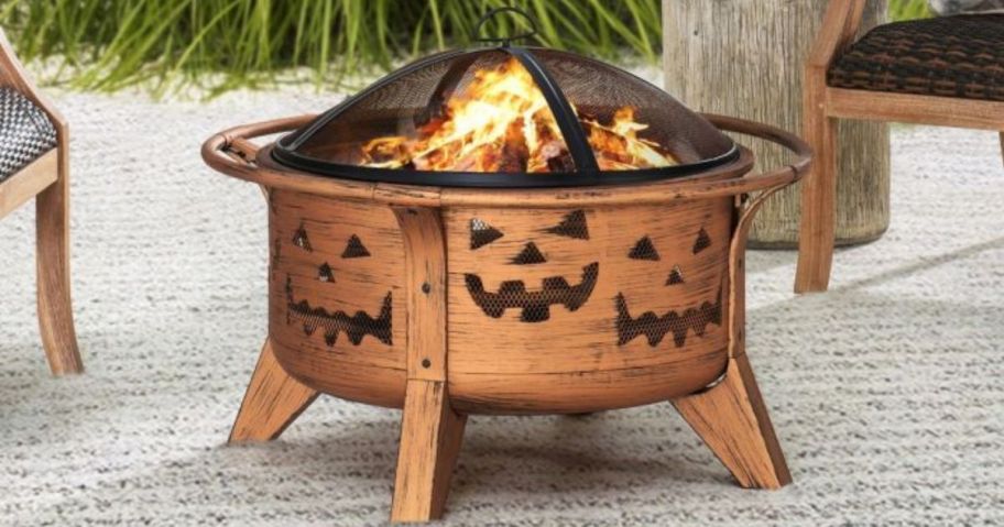 A fire pit with Jack-O-Lantern faces 