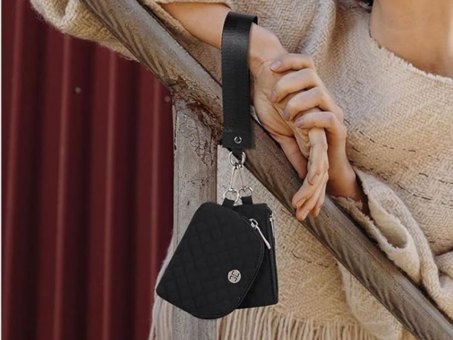 Telena Mini Zip Wristlets w/ Dual Pouches hanging from wrist