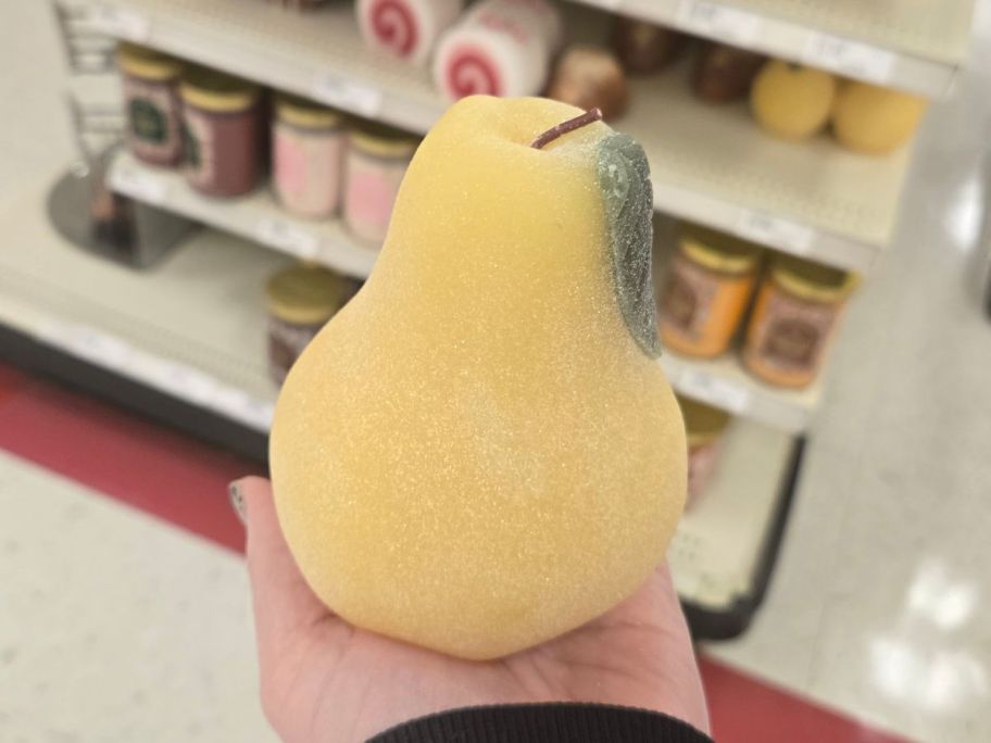 Threshold Sugared Pear Figural Candle in hand in store