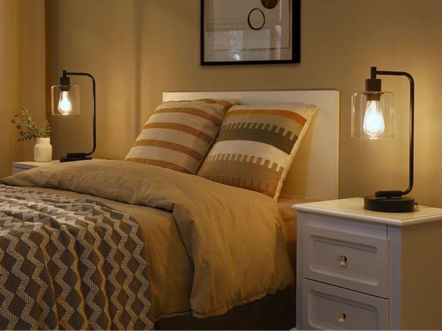 Bed with two Beachcrest Home Touch Control Table Lamps on the bedside tables on each side