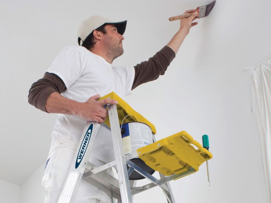 man painting a ceiling on a Werner 360 6' Aluminum Step Ladder