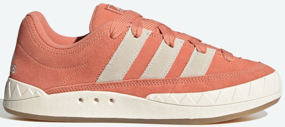 orange and white suede adidas sneaker