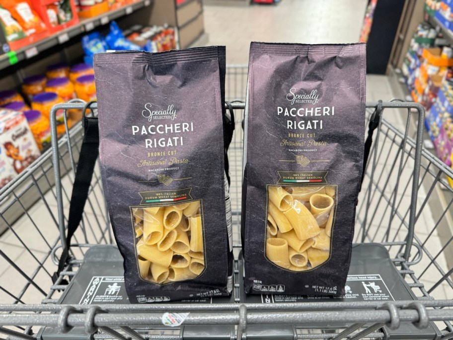 2 bags of Specially Selected Paccheri Rigati pasta in an Aldi shopping cart