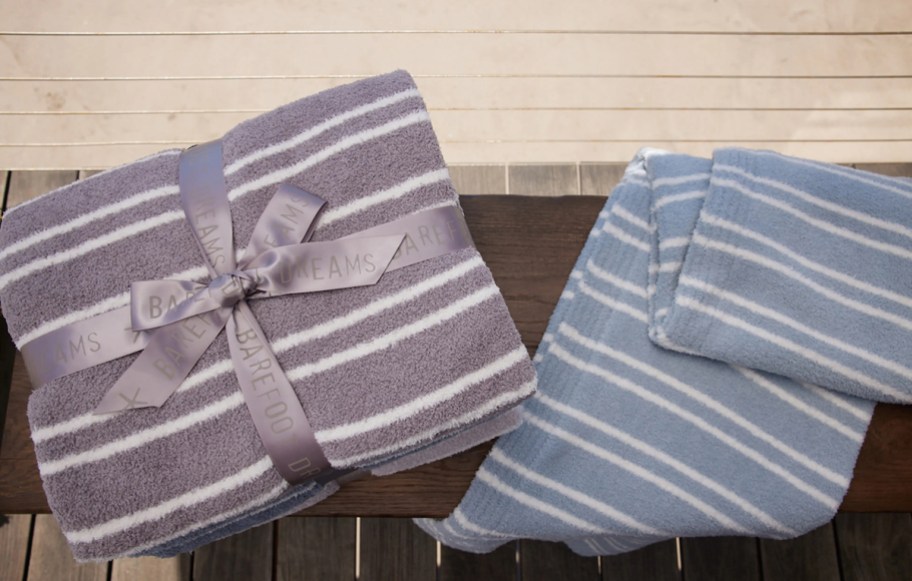 stripe barefoot dreams blankets on bench
