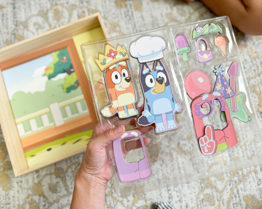 hand holding wooden magnet bluey accessories