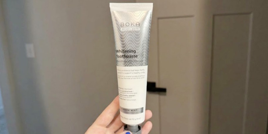 hand holding boka toothpaste