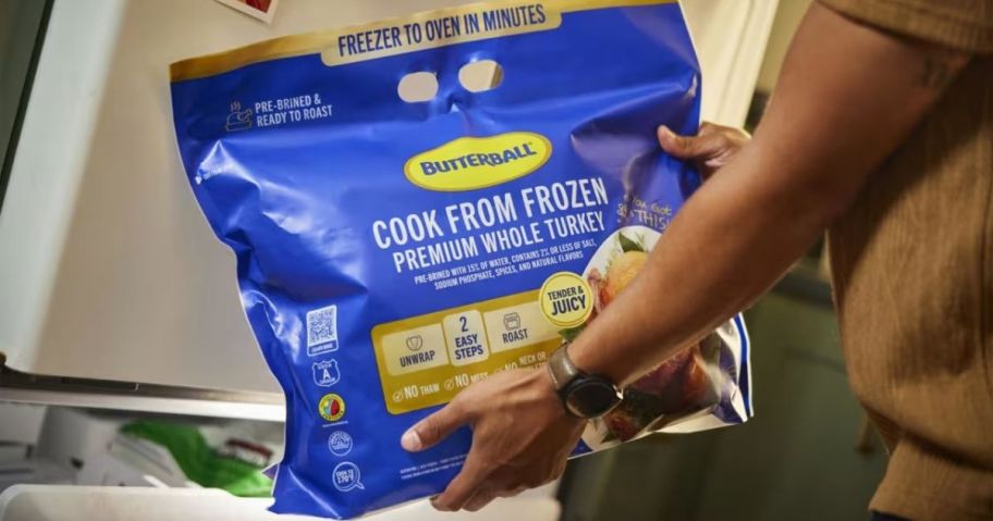 woman holding butterball frozen turkey bag in kitchen