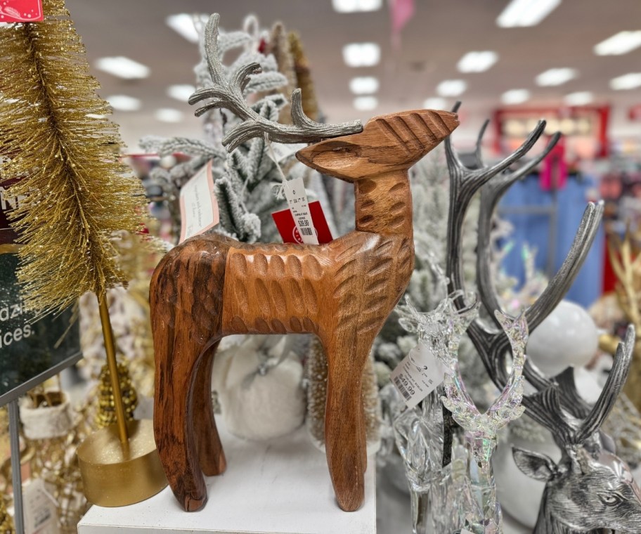 carved wooden reindeer with antlers