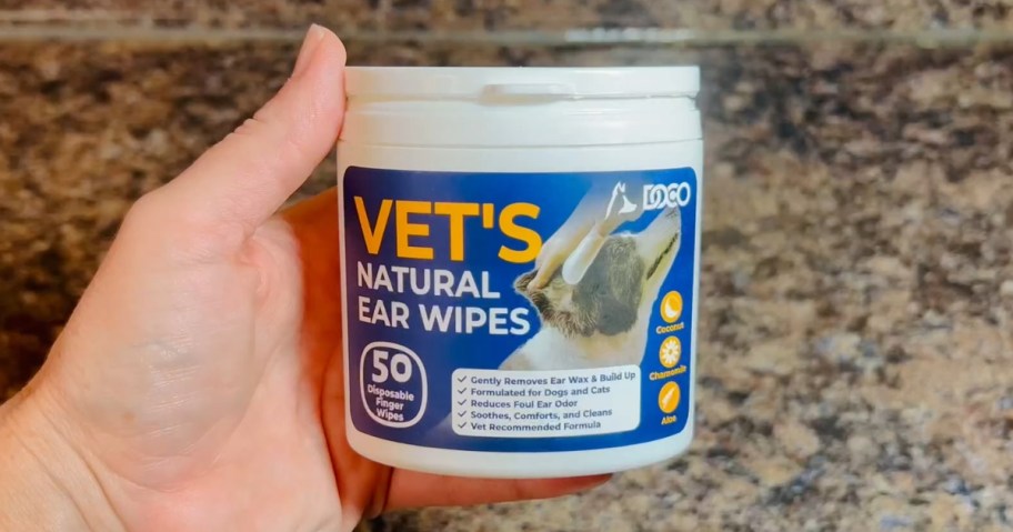 hand holding a container of Pet Ear Wipes