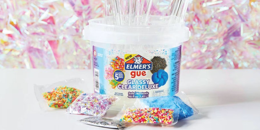 elmer's gue bucket on table with 5 mix ins bags 