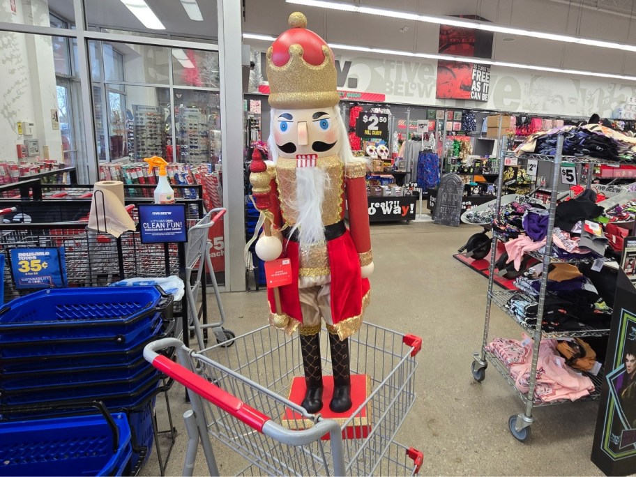 large Christmas Nutcracker figure in a Five Below shopping cart in store