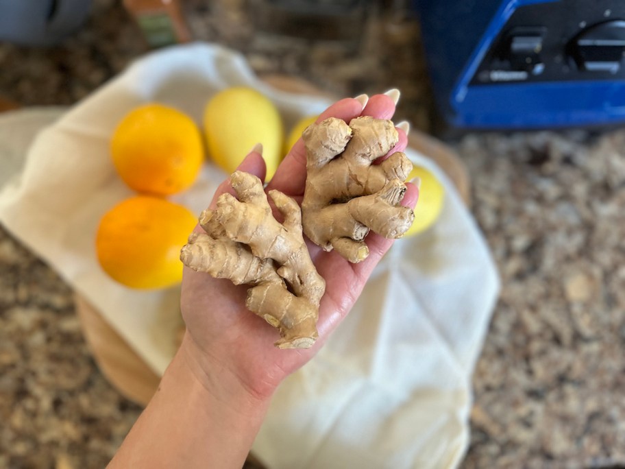 hand holding ginger root