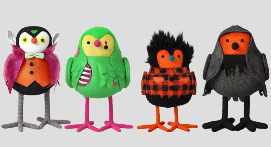 four felt bird figurines dressed in halloween costumes