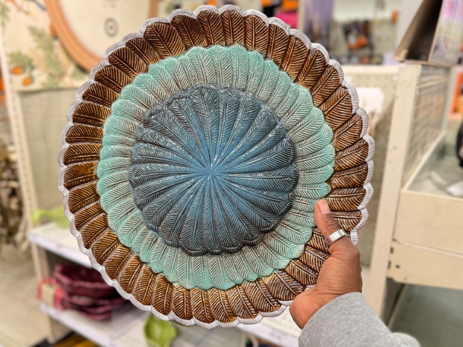 hand holding feathers serving tray 