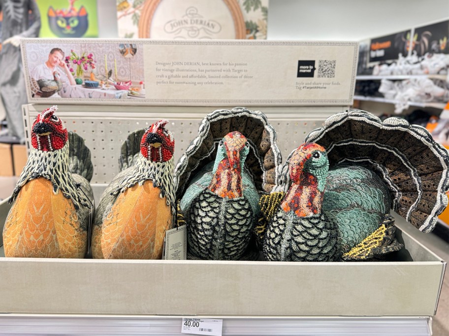 yellow and green colored turkey plushes on shelf 