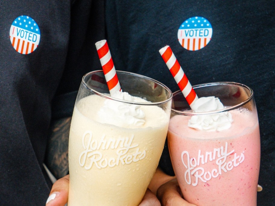 two milkshakes with red striped straws