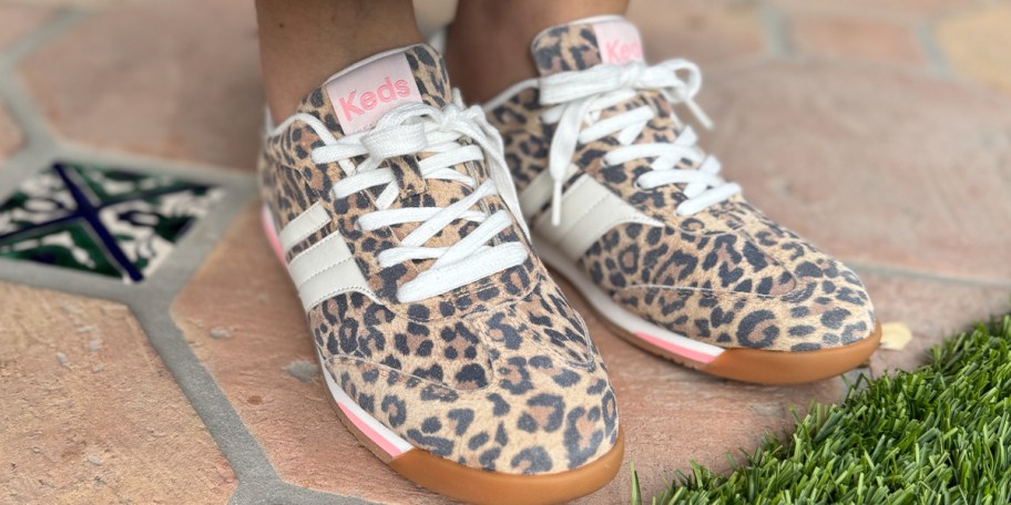 person wearing cheetah print keds shoes 