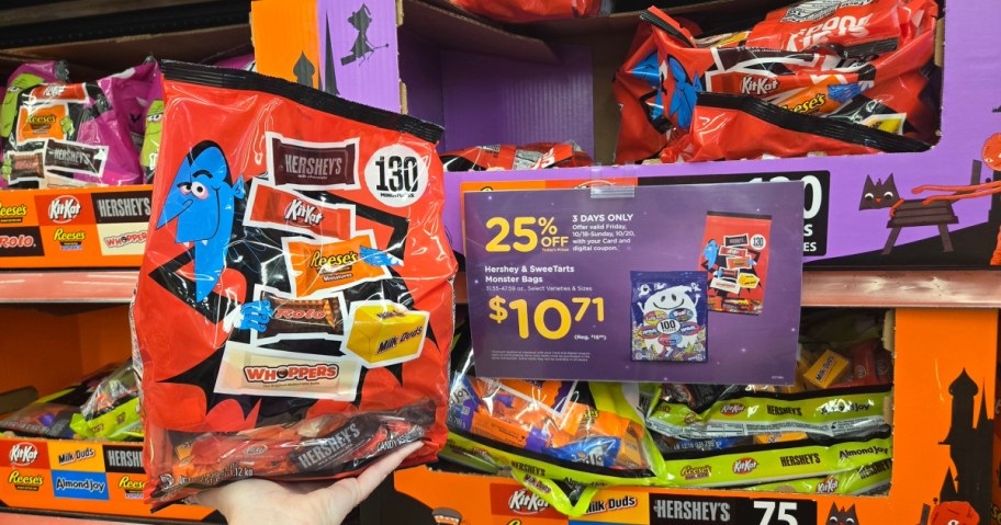 bag of kroger halloween candy next to a sale sign