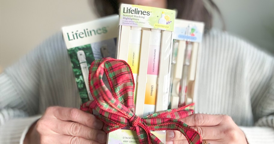 person holding lifeline pen packs