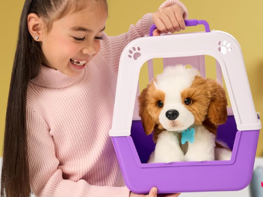 girl holding puppy carrier