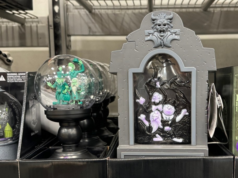 Disney Haunted Mansion Halloween Decor - a globe and small tombstone