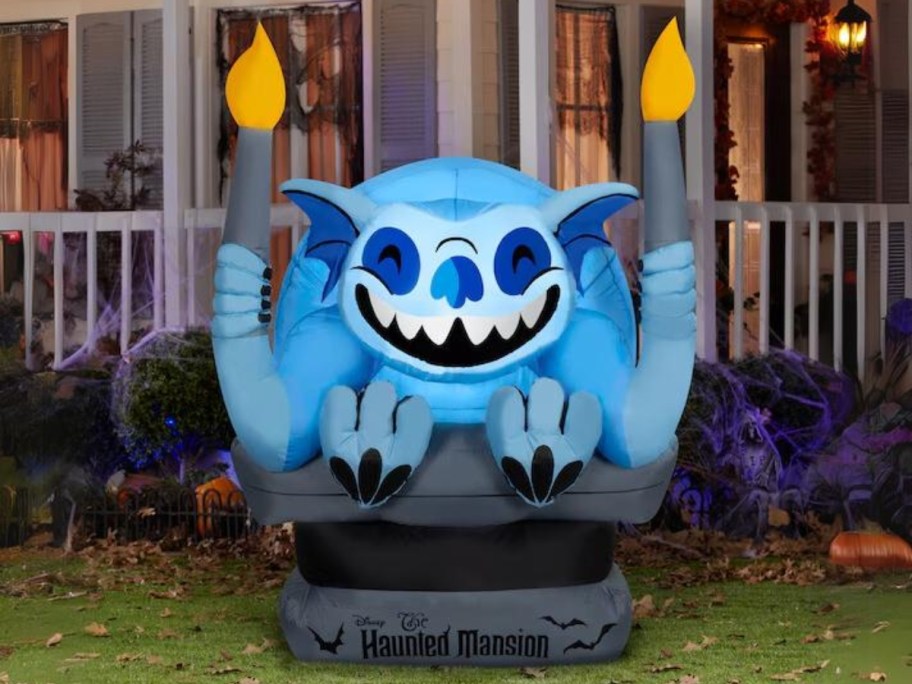 a large Disney 5.5-ft The Haunted Mansion LED Gargoyle Inflatable in a front yard