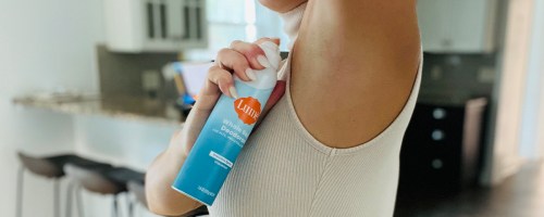 woman putting on lume whole body deodorant