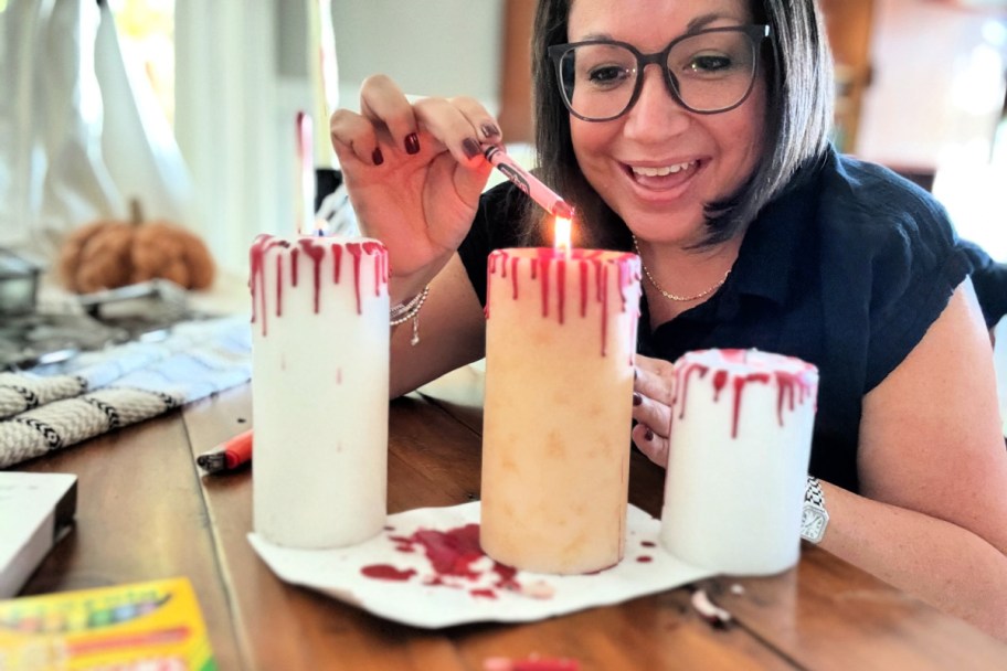 melting a red crayon on candles