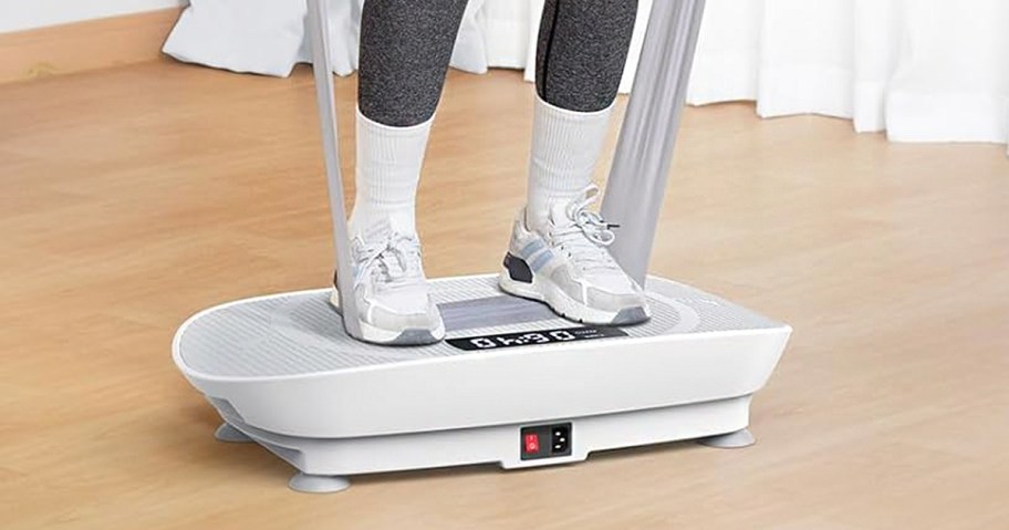 person standing on white vibration machine