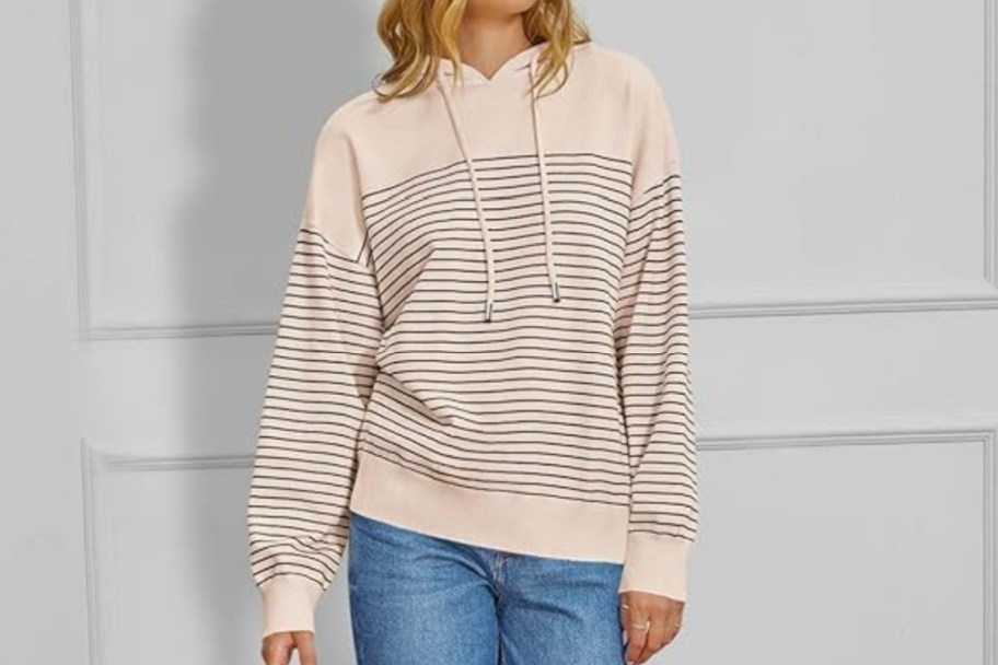 woman in beige striped sweatshirt