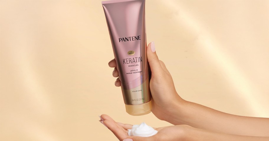 pantene conditioner being squeezed into hand