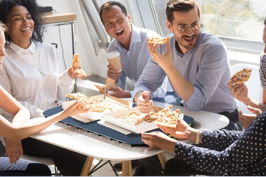 people eating pizza with their mat