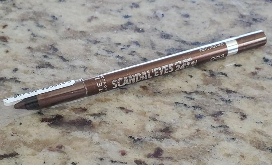 rimmel scandaleyes eye liner pencil on a granite countertop