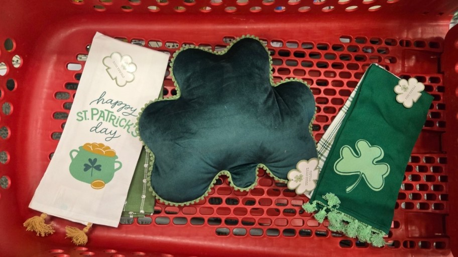 2 dish towle sets and a shamrock pillow in target cart