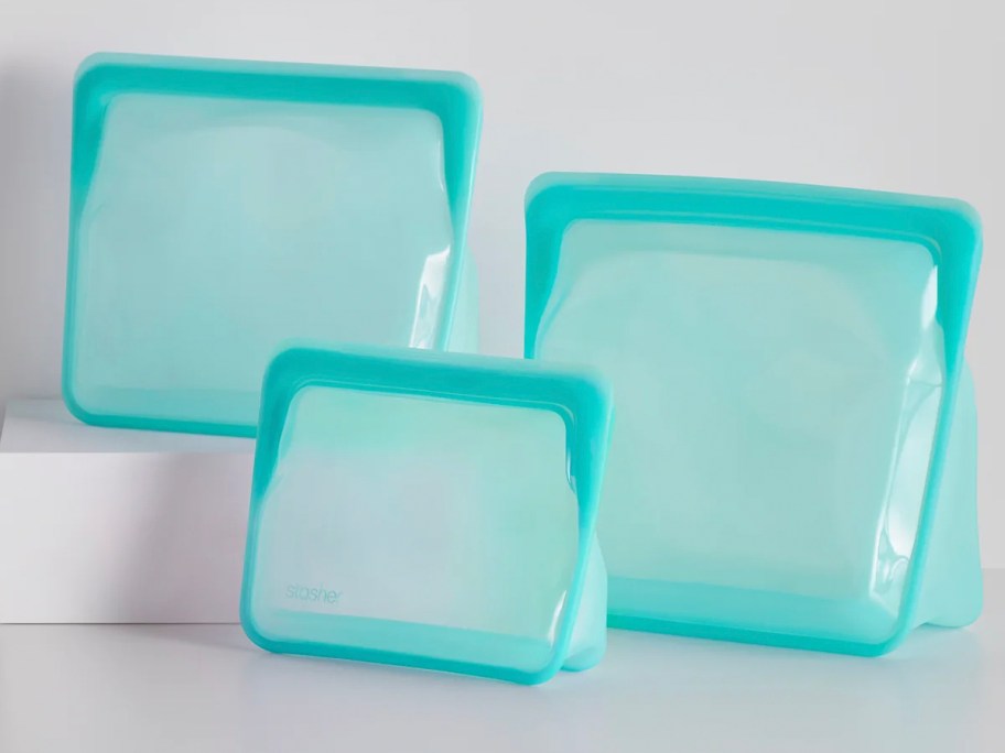 three blue stasher bags 