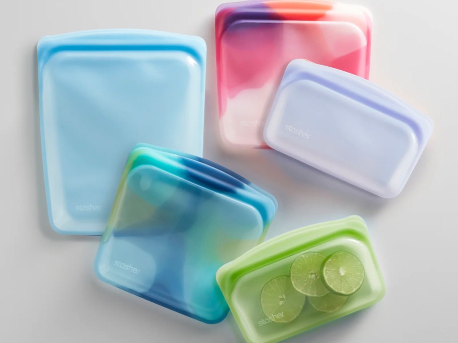 blue, purple, green, and multicolored lunch bags 