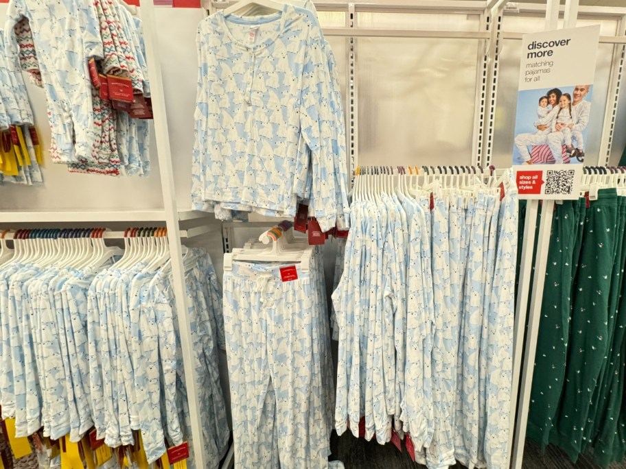 blue and white pajama tops and pants with polar bears on them on a store display in Target