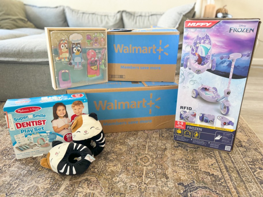 walmart boxes surrounded by items for sale at walmart, including squishmallows slippers, disney bubble scooter, and bluey magnetic playset