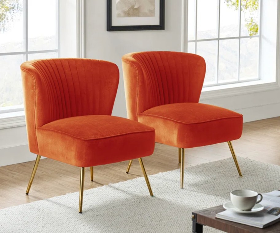 two upholsetered orange chairs