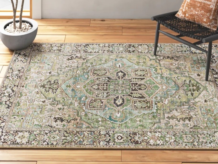 a brown, green, and yellow oriental style area rug in a living room