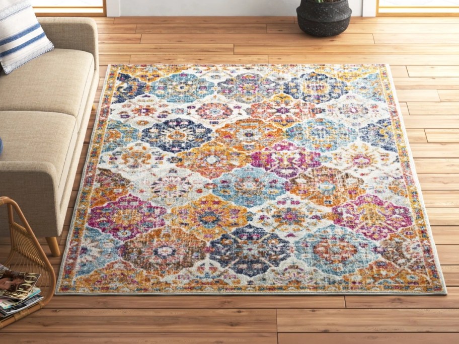 a colorful medallion oriental print area rug in a living room