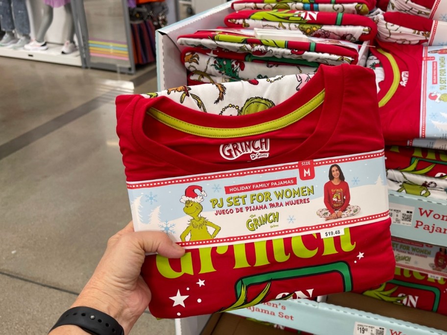 a womans hand holding a matching pj set for women