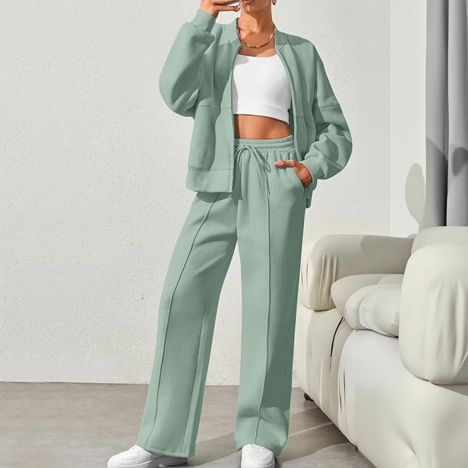 woman wearing green tracksuit and white tee 