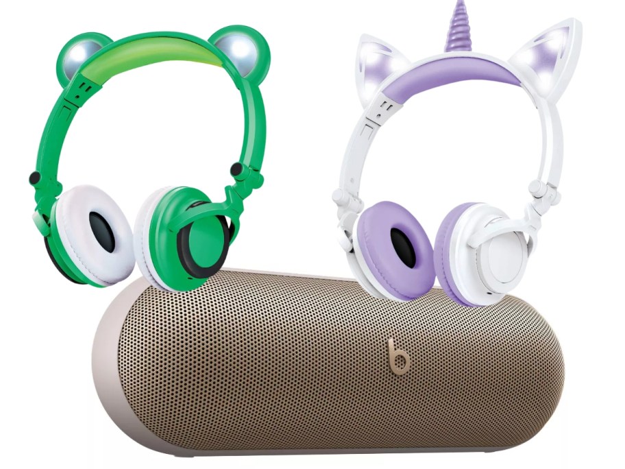 Children's headphones shaped like frogs and unicorns and a tan Beats Pill-shaped Bluetooth speaker