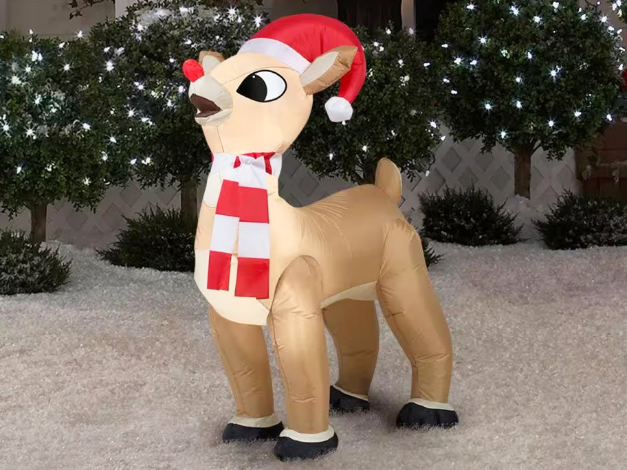 Rudolph with Santa Hat and Scarf inflatable in yard