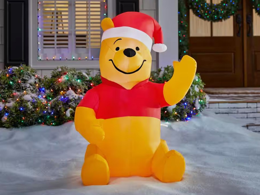 winnie the pooh wearing santa hat inflatable