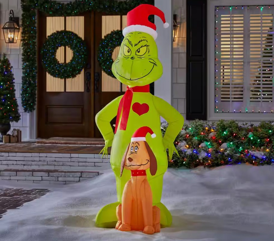 Grinch with Max inflatable in yard