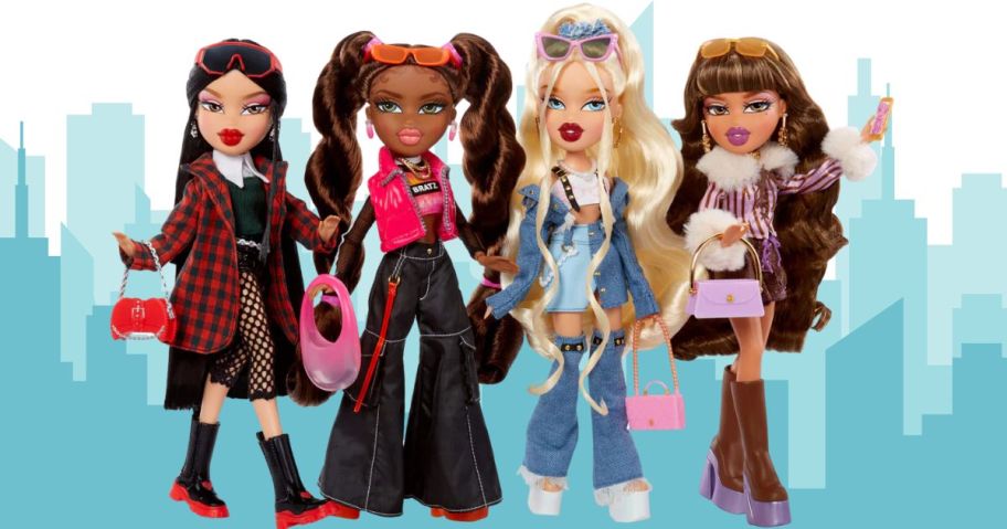 4 Bratz dolls in front of a cityscape 