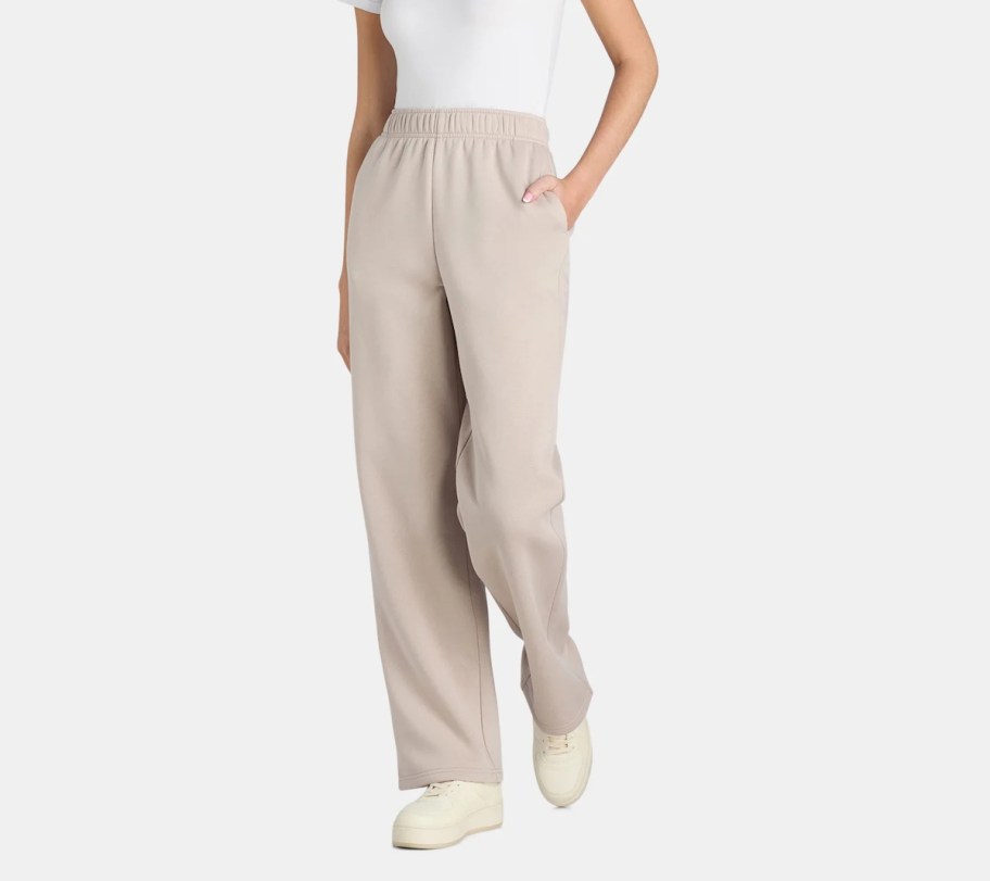 stock photo of bottom half of woman wearing beige fleece sweatpants