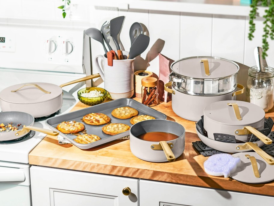cook and bakeware set on kitchen counter